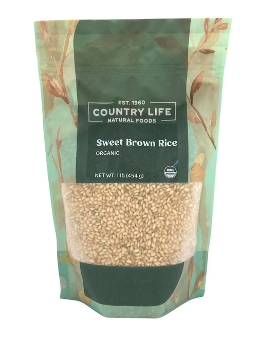 Organic sweet brown rice grains in a scoop