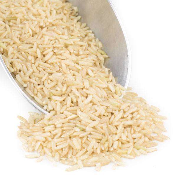 Organic brown basmati rice grains in a scoop